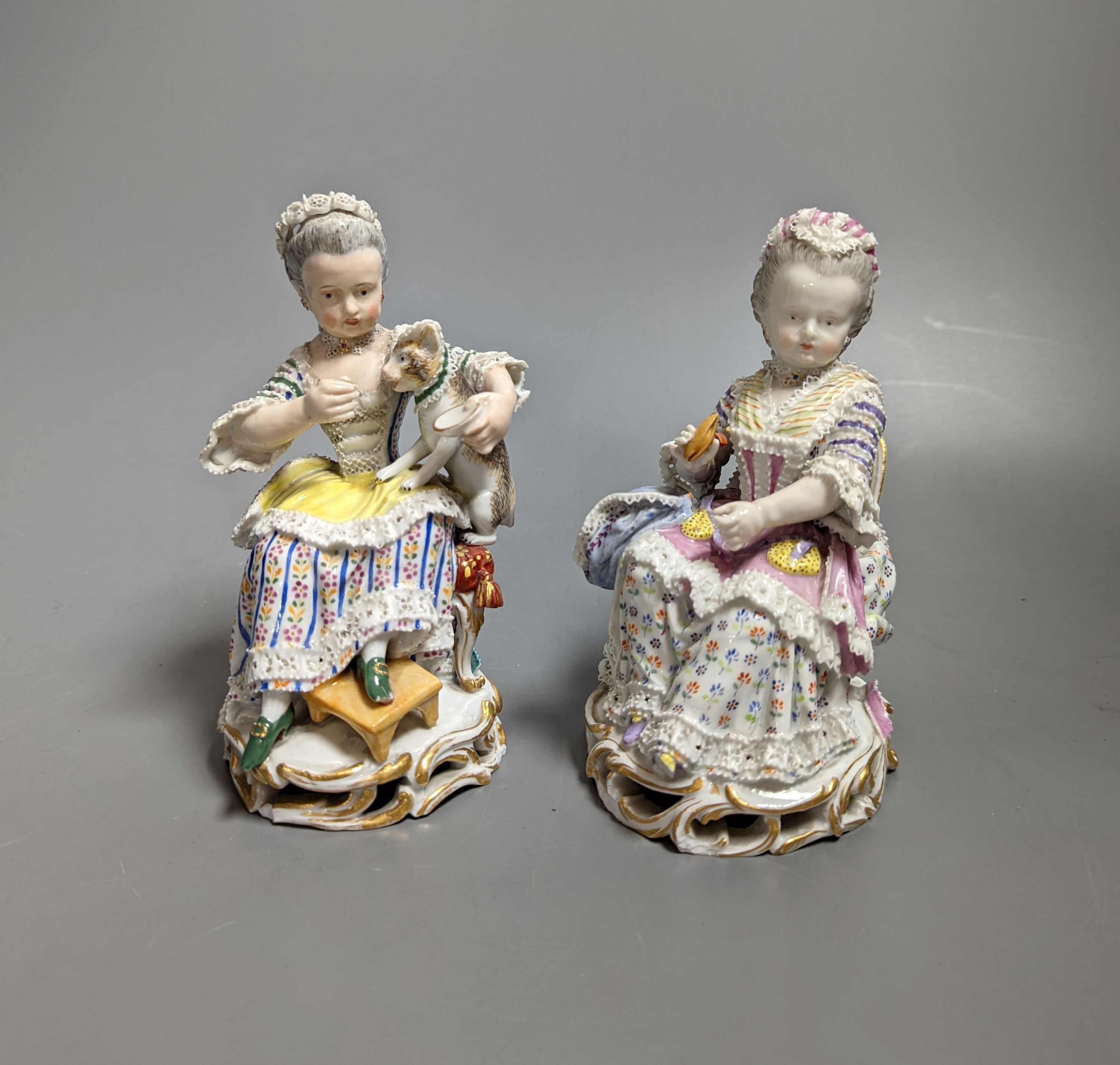 Two 19th century Meissen figures of seated ladies 13cms high